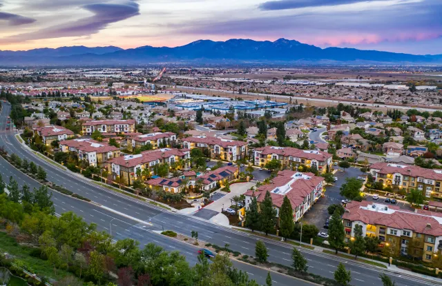 Chino Hills aerial with mountains at sunset